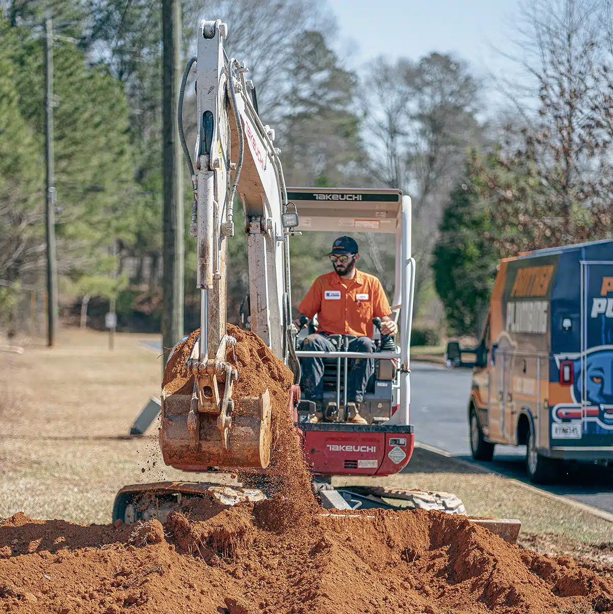 An equipment operator on an excavator in Austell, GA