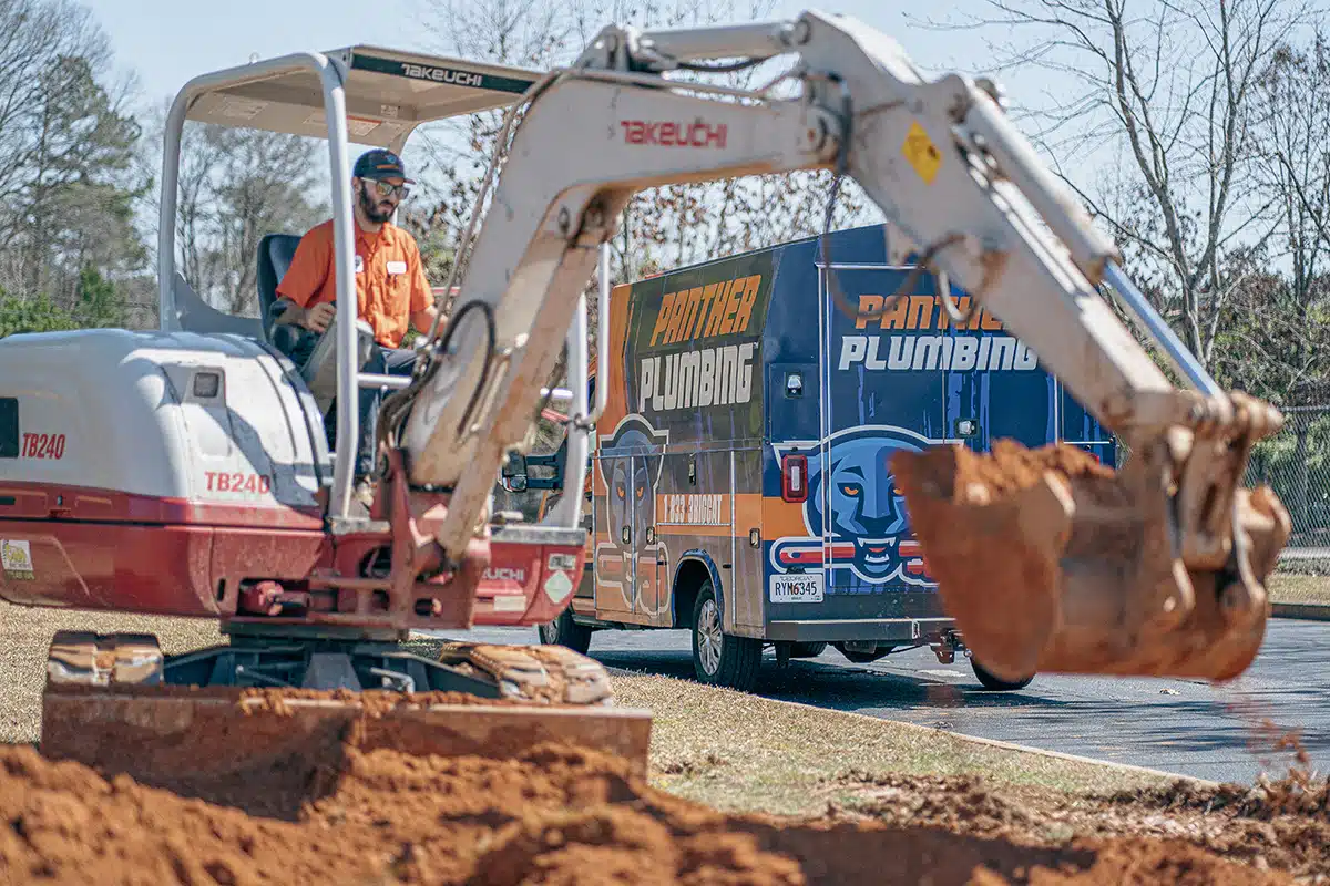 An equipment operator on an excavator in Austell, GA